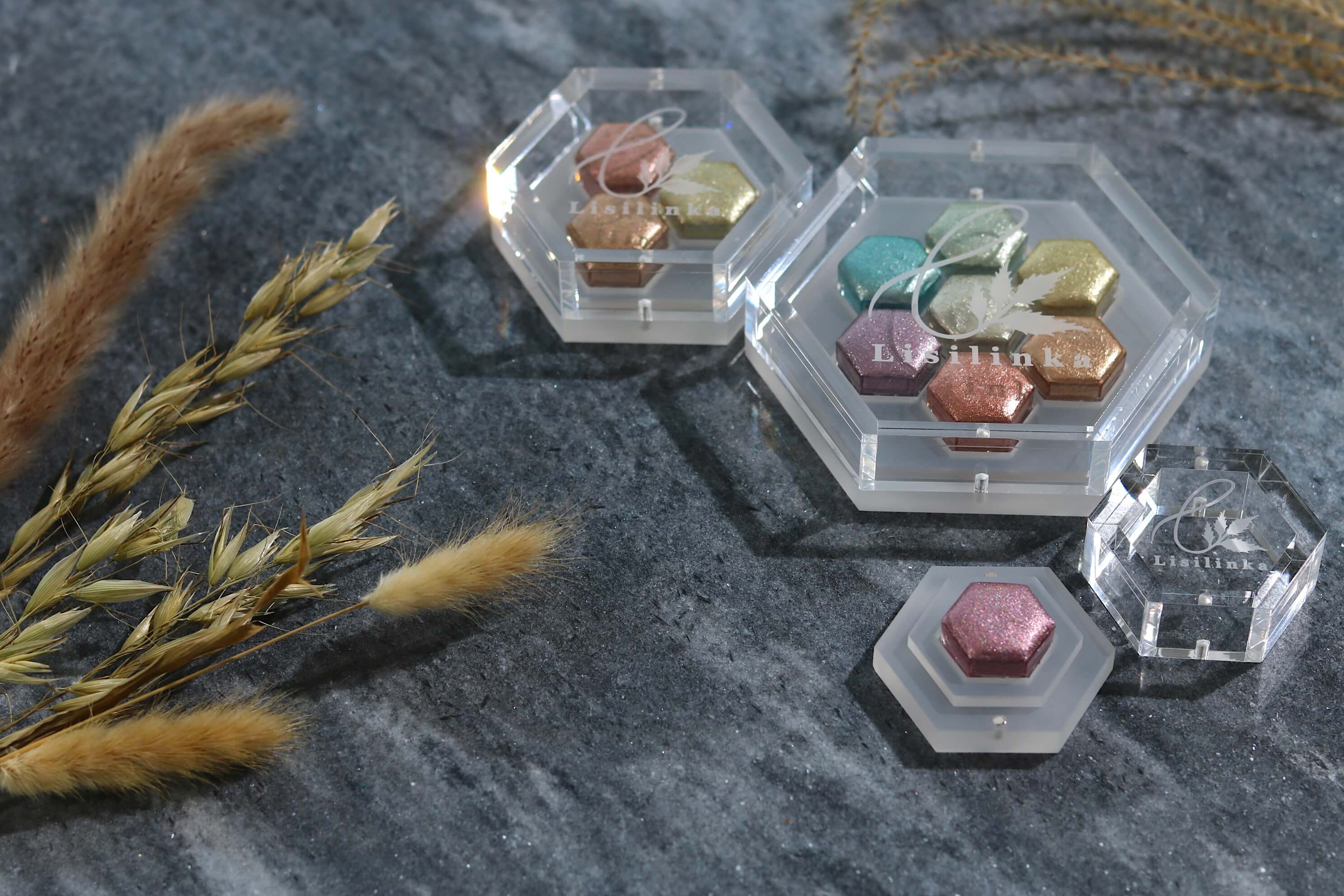 Open box of handmade Lisilinka metallic watercolors showing intense sparkle and custom hexagon pans