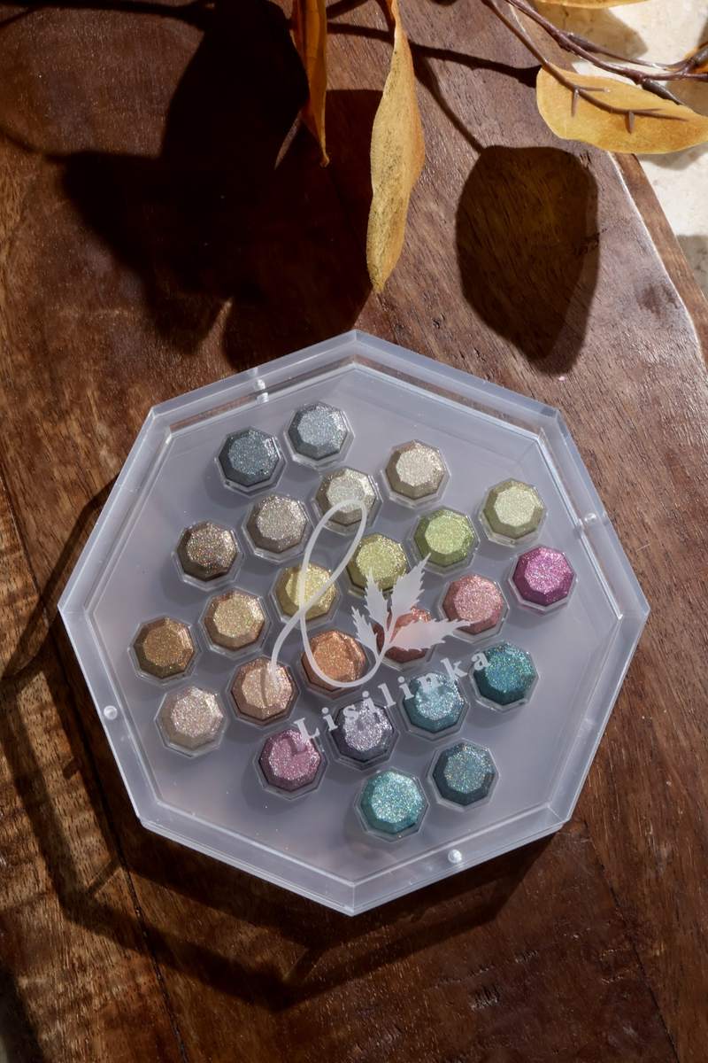 Season of Change: top view of the 24 Lisilinka Octagon pans in the acrylic box