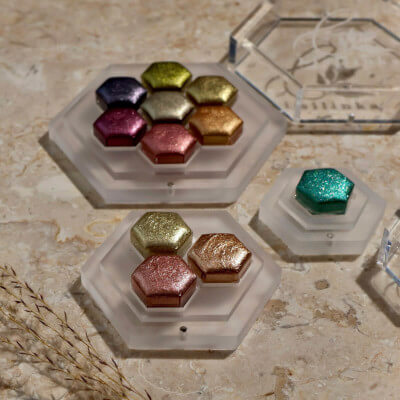 Lisilinka custom hexagon watercolor pans on marble surface with unique design
