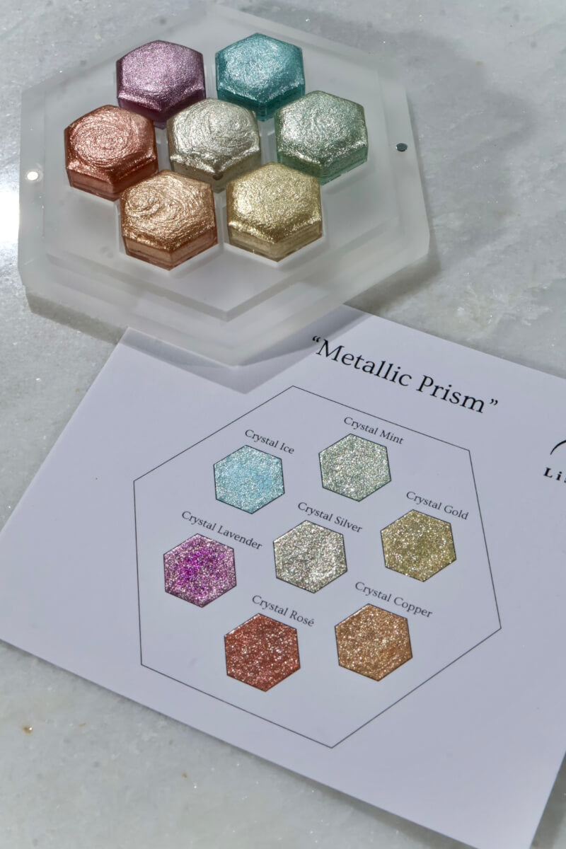 Metallic Prism set — 7 handcrafted metallic watercolors in hexagon pans with the matching swatch card, in shades of silver, gold, copper, rosé, lavender, ice blue and mint