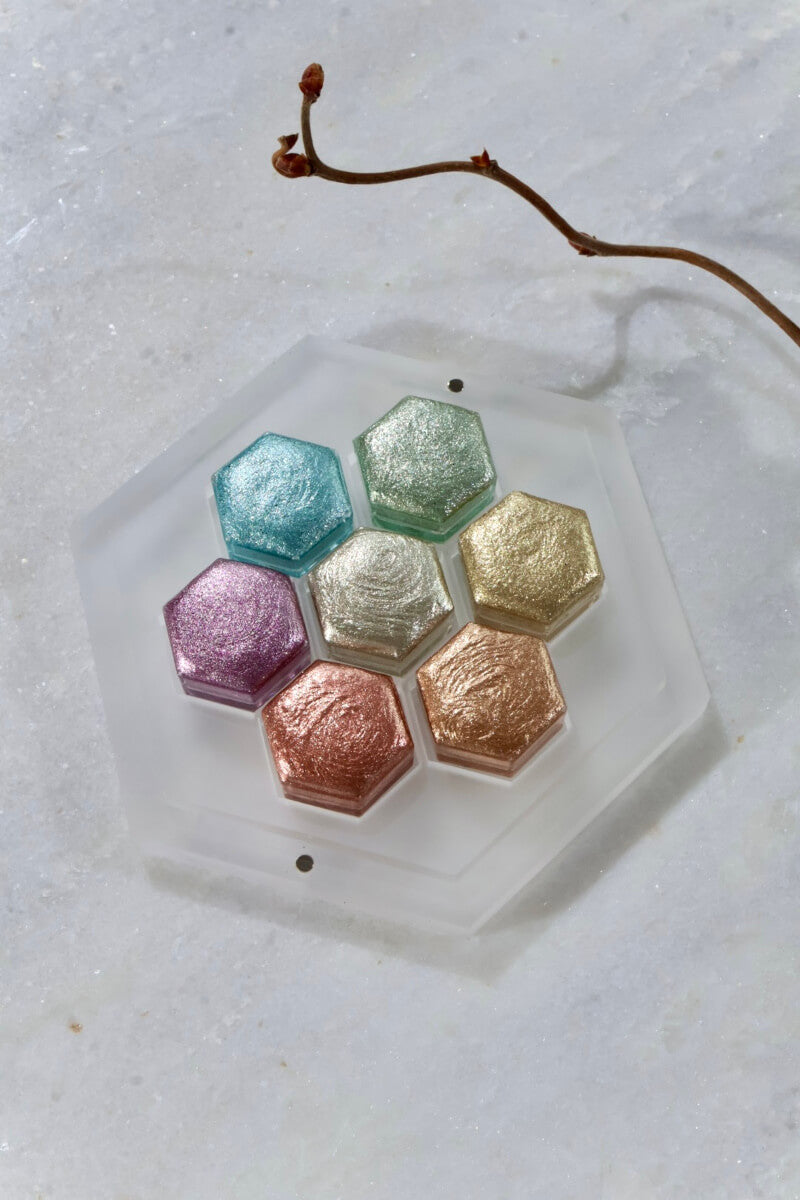 Lisilinka Metallic Prism set with seven hexagonal metallic watercolor pans in gold, silver, copper, rosé, ice, mint and lavender