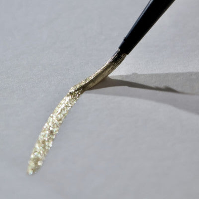 Metallic watercolor swatch on white and black paper showing high opacity by Lisilinka