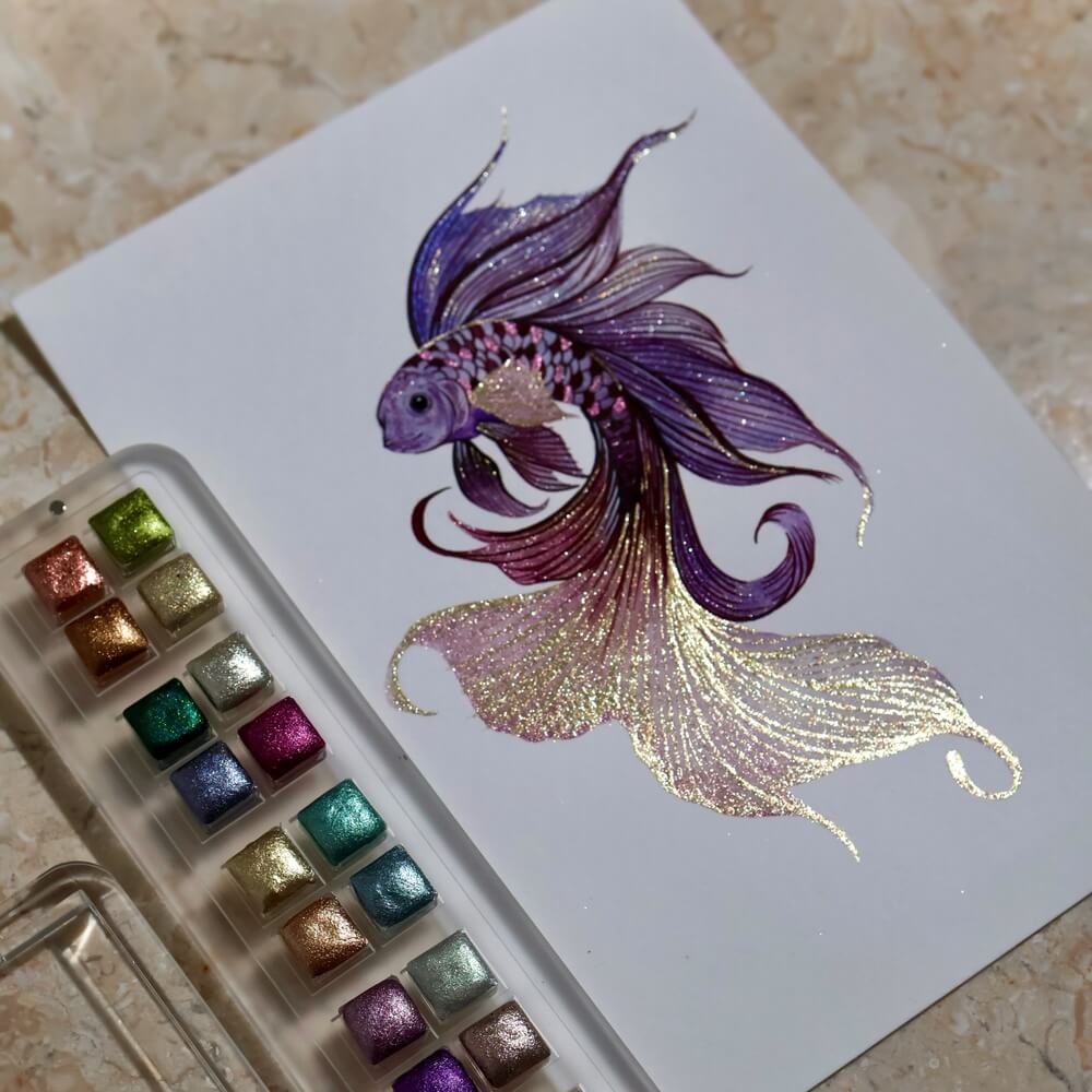 Purple and gold betta fish painted with Lisilinka metallic watercolors next to the color palette